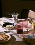 Blush tumblers on a breakfast table with coffee and eggs