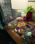 Six pastel coupe glasses, one in each Rayt colour