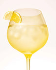 Summer Yellow goblet with ice and a lemon slice