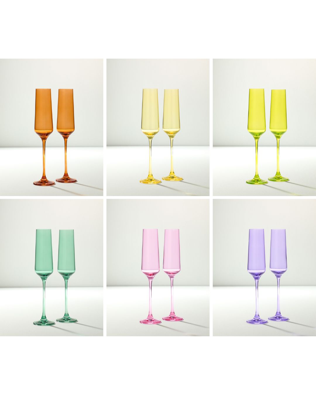 Set of colorful champagne flutes on a white background