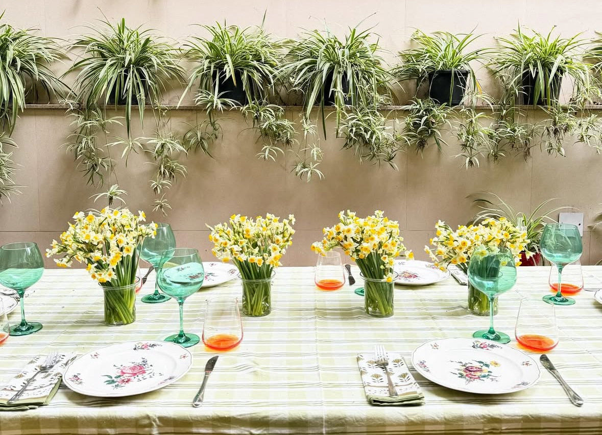 Nature Green goblets on an outdoor dining table with plants