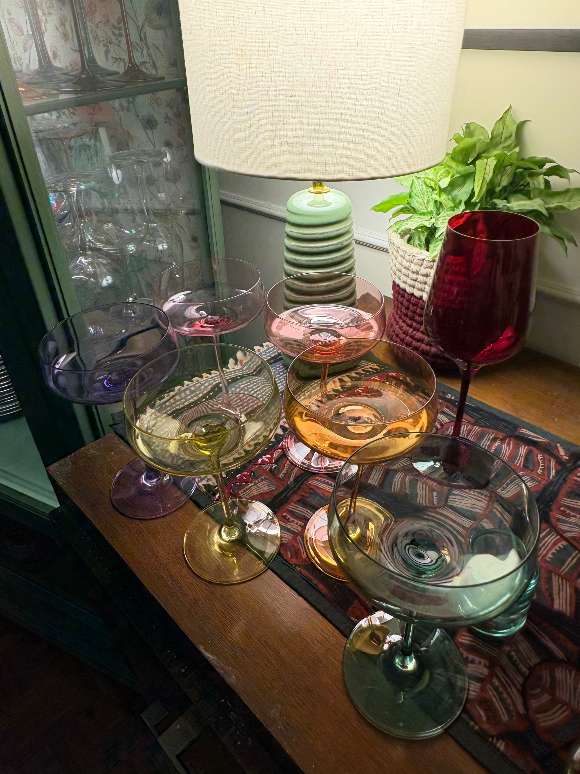 Six pastel coupe glasses, one in each Rayt colour